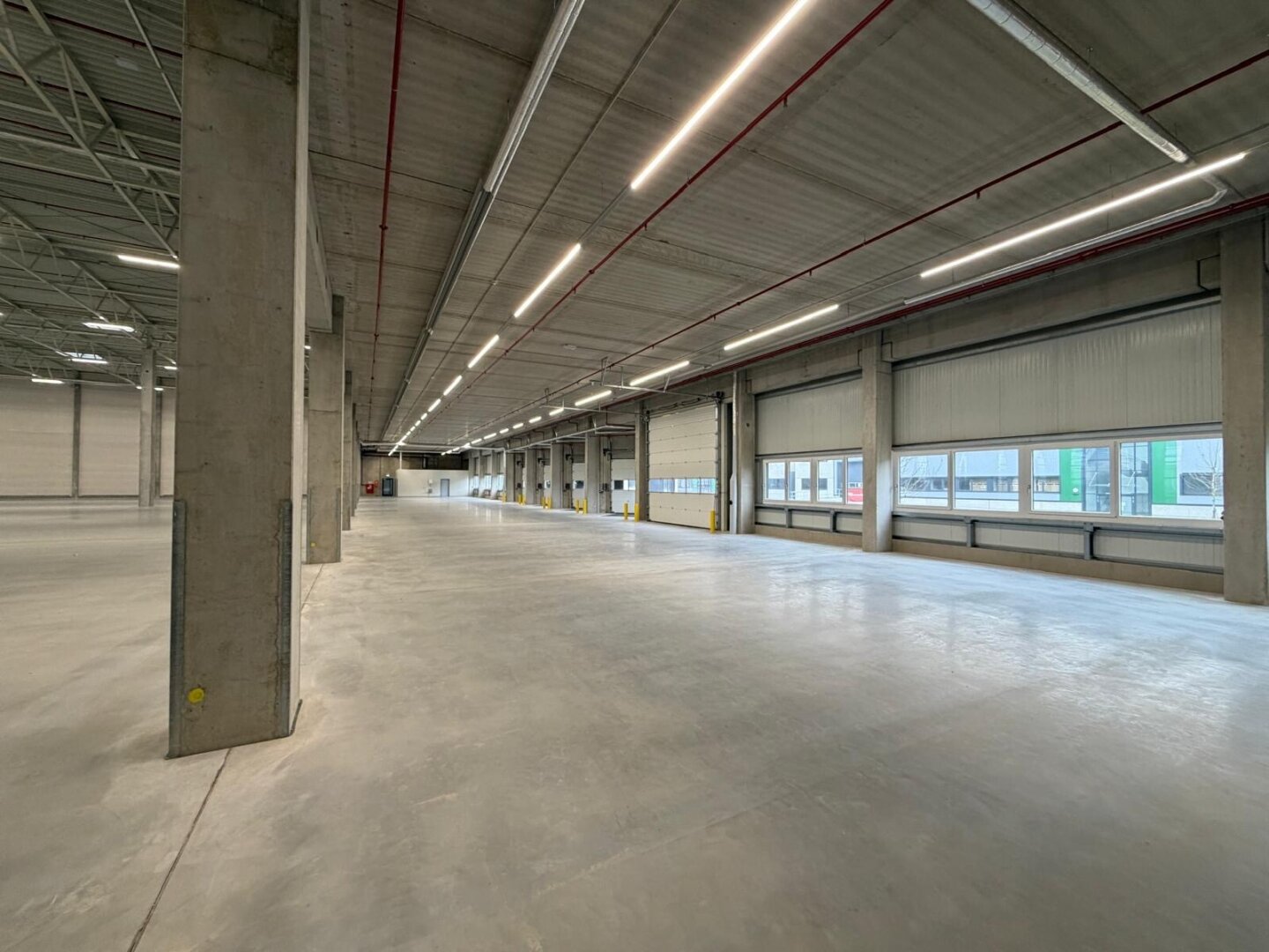 NEUBAU  - Produktions / Lagerhalle mit Büroflächen in Enns/Ennshafen zu vermieten – individuell und zukunftsorientiert