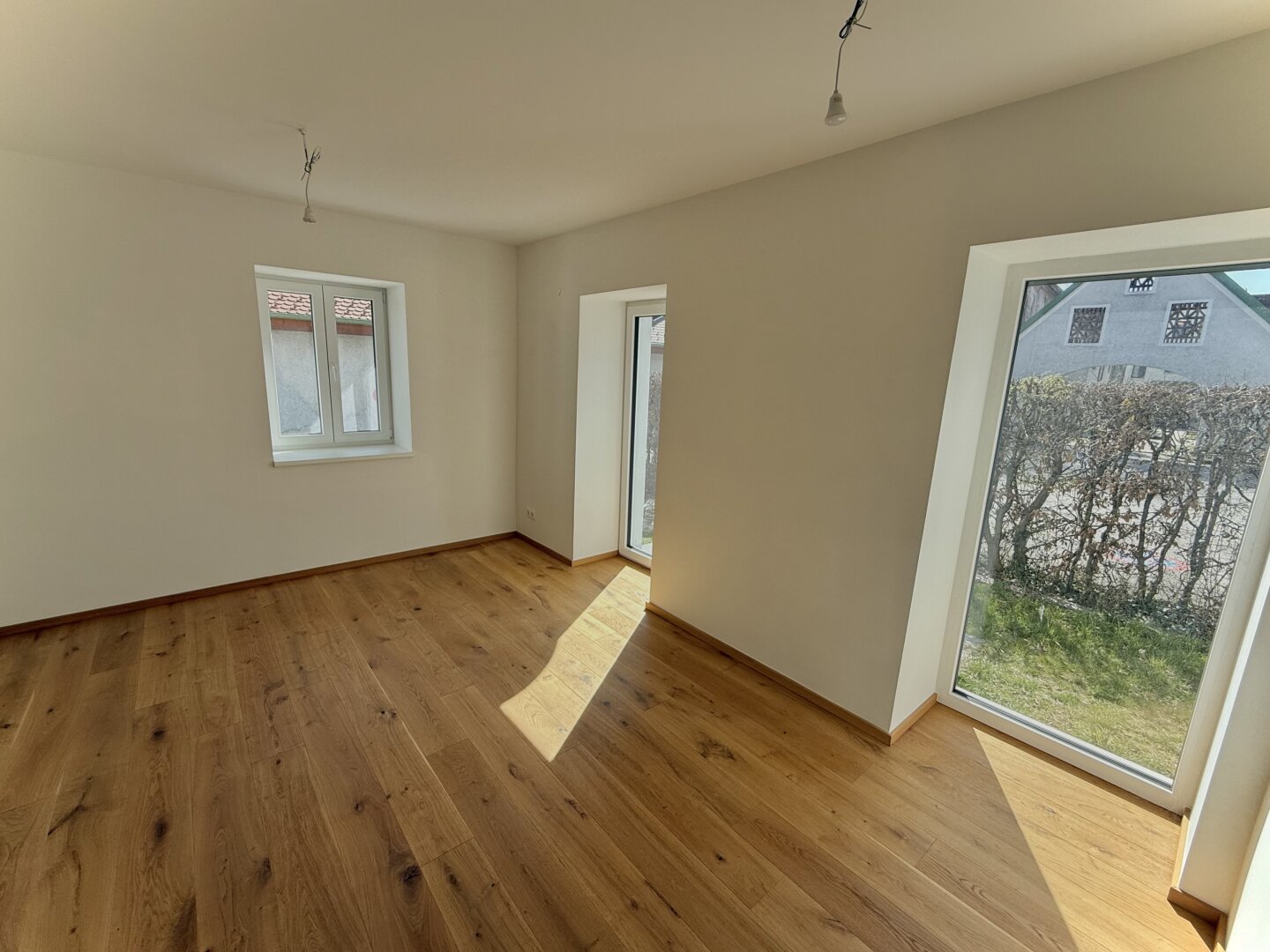 Lichtdurchflutete Erstbezugswohnung mit Garten!