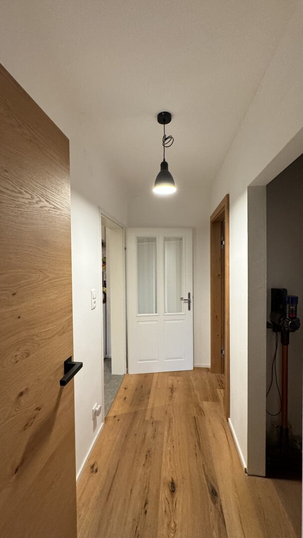 Mauer "Licht. Ruhe. Effizienz. Stilvolle Maisonette mit Südterrasse" | ZELLMANN IMMOBILIEN